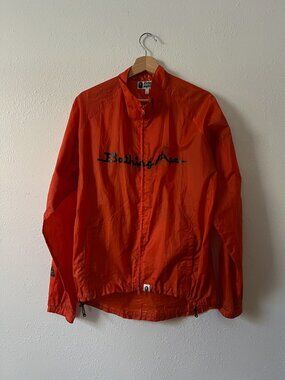 Vintage neon orange BAPE windbreaker jacket with large logo